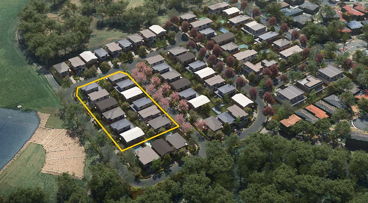 Aerial view of a residential neighbourhood with a section of houses outlined in yellow amid tree-lined streets, showcasing new land development and premium homesites.